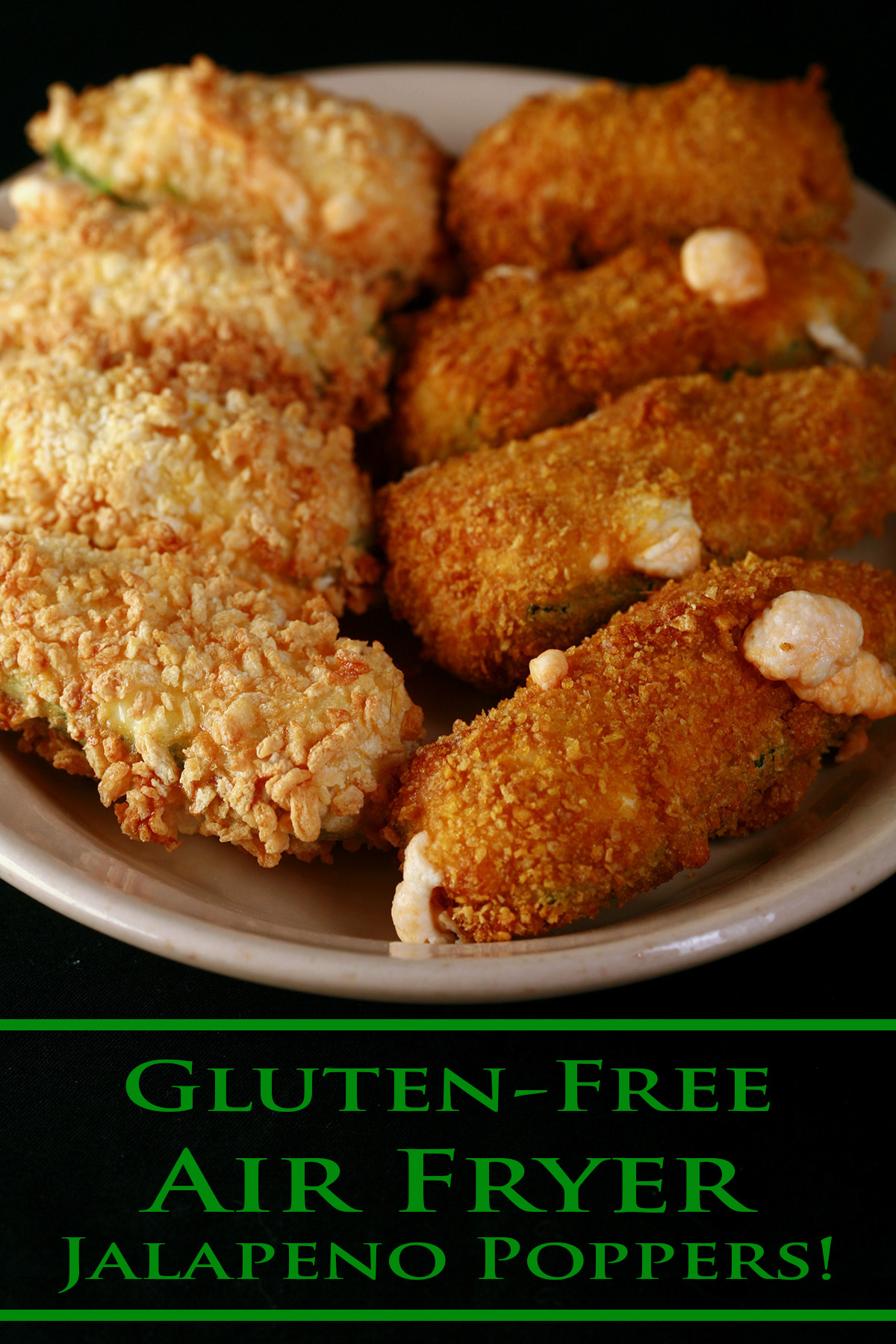 A small ivory colour plate holds two different types of gluten-free jalapeno poppers. They have been cooked in an air fryer.