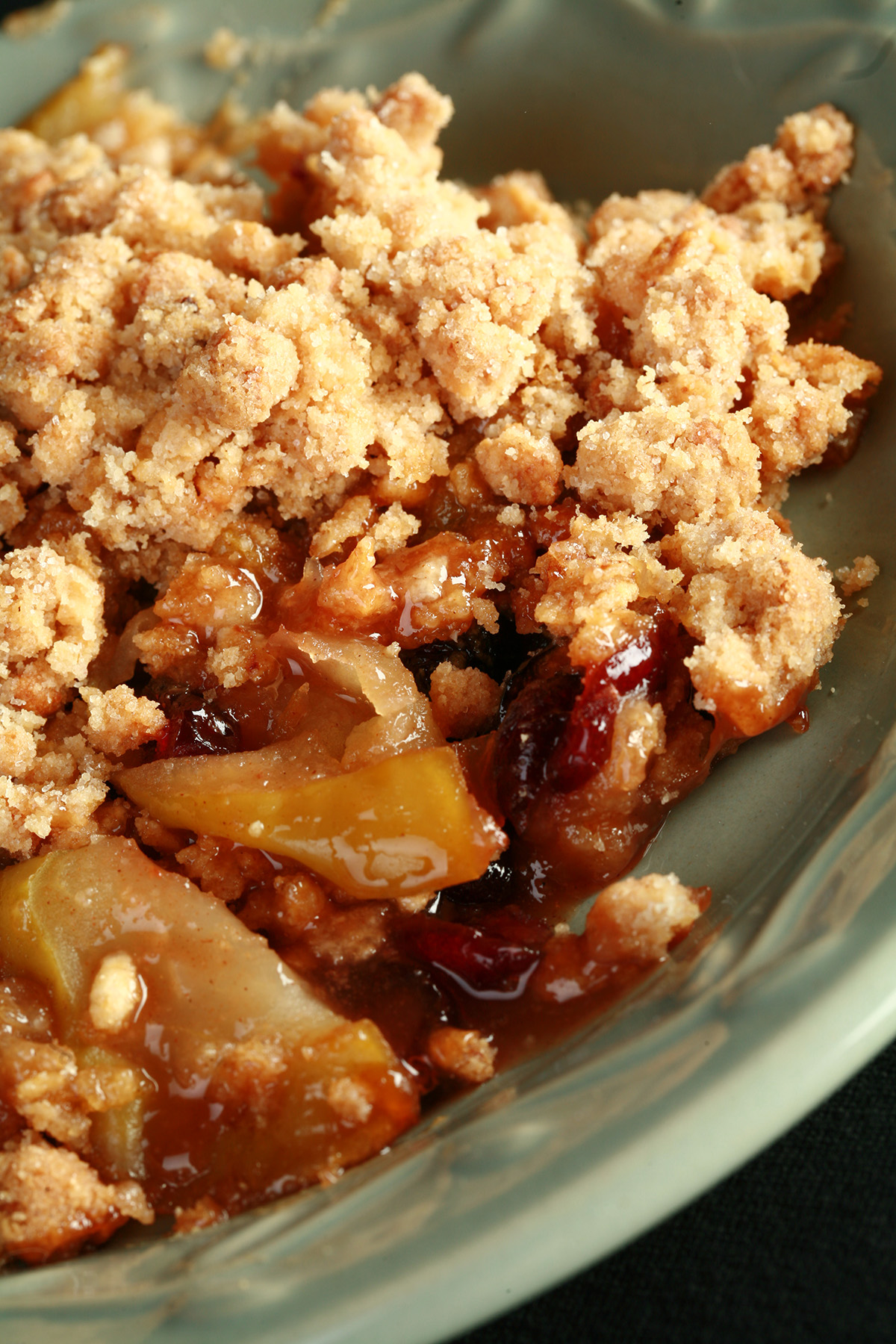 A plate with a generous serving of gluten-free Brandied Apple Crisp.