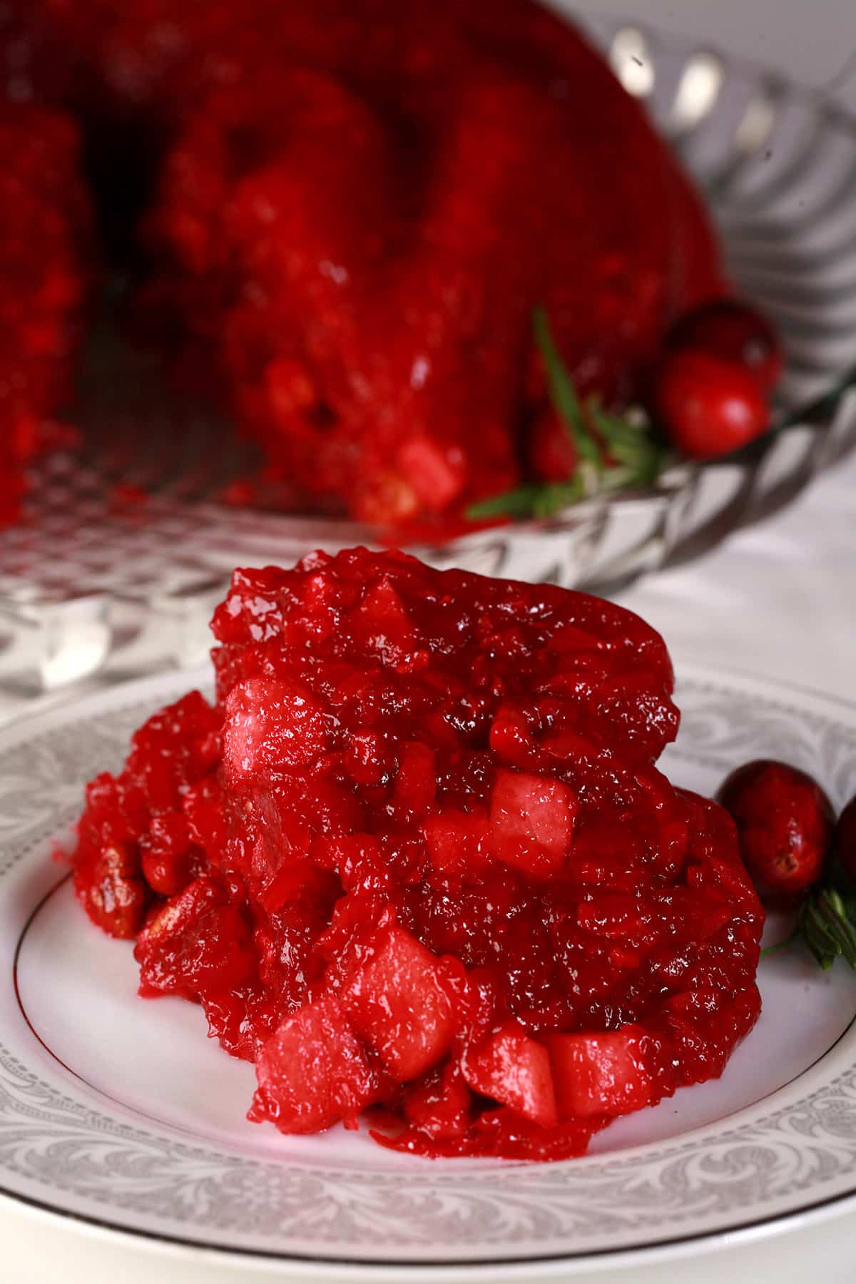 A serving of cranberry Jello salad on a plate.