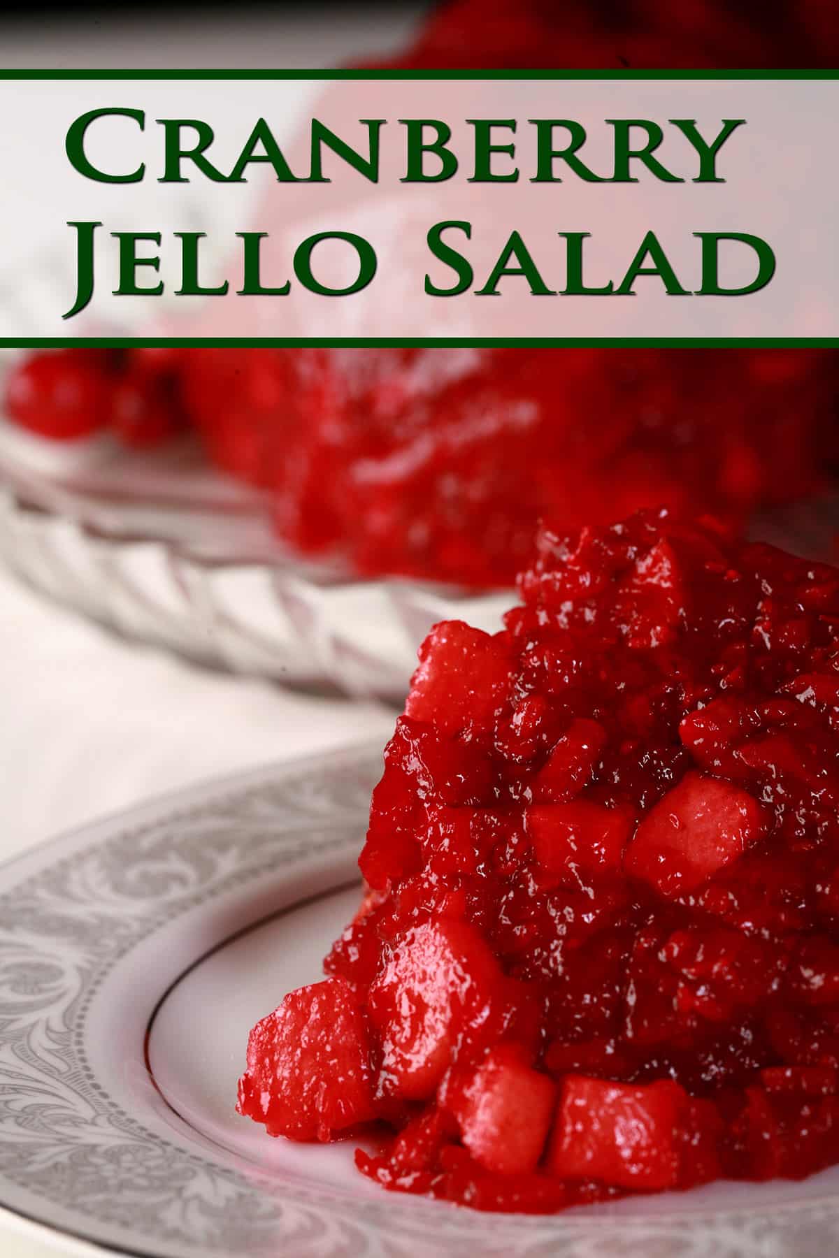 A serving of cranberry Jello salad on a plate.