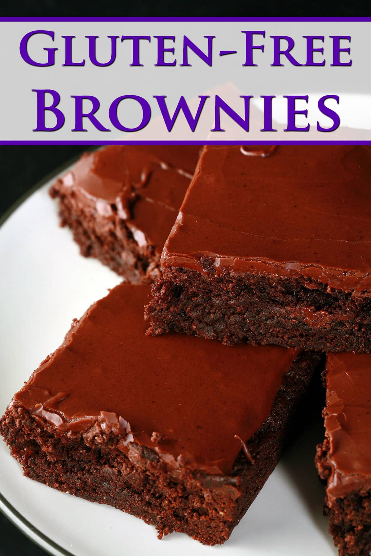 A plate of gluten free brownies with chocolate glaze.