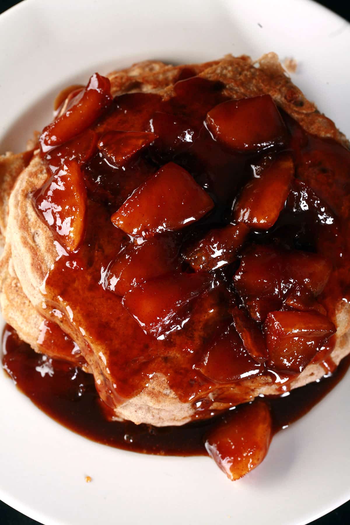 A stack of gluten-free caramel apple pancakes.