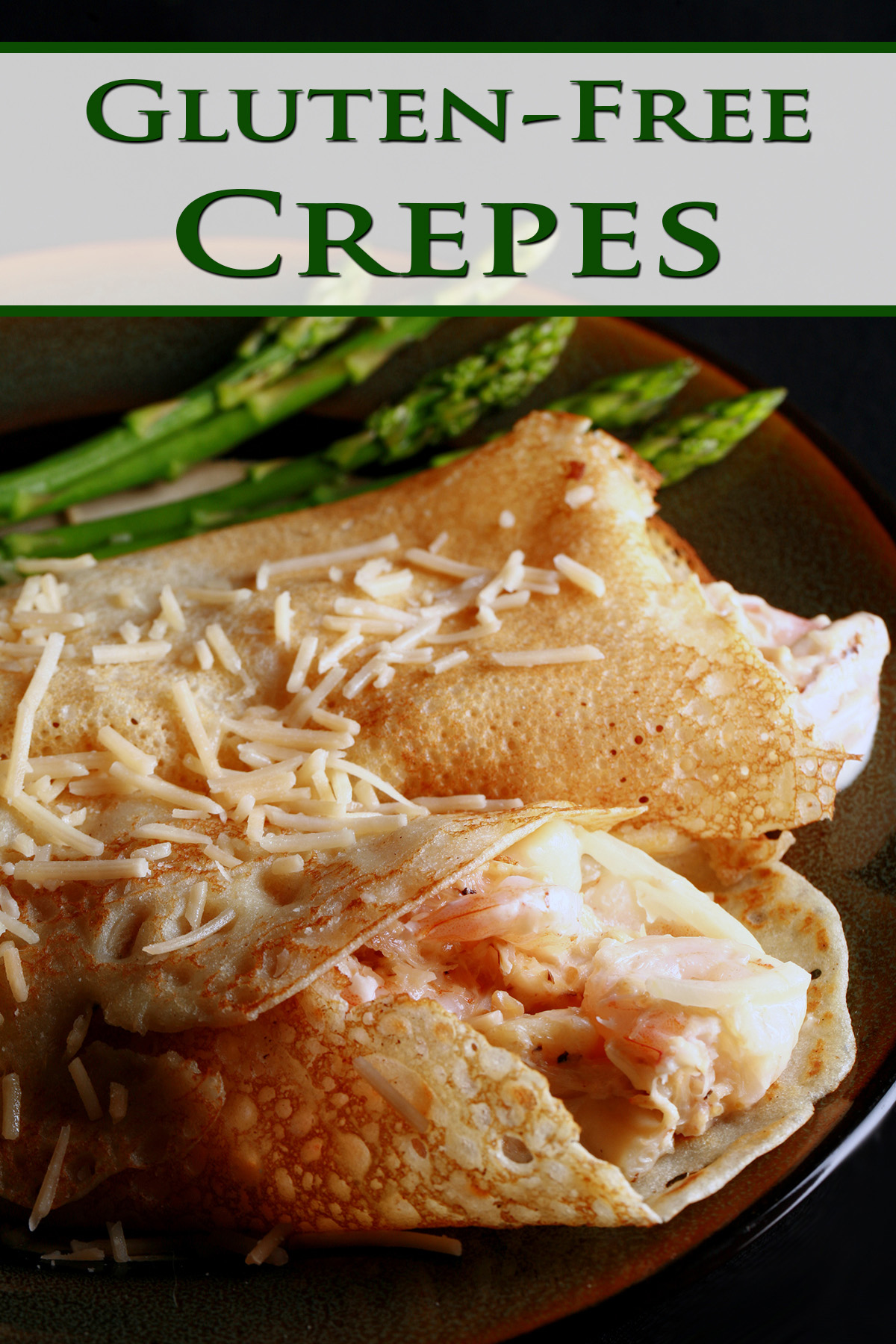 2 Gluten free seafood crepes with asparagus spears on the side.