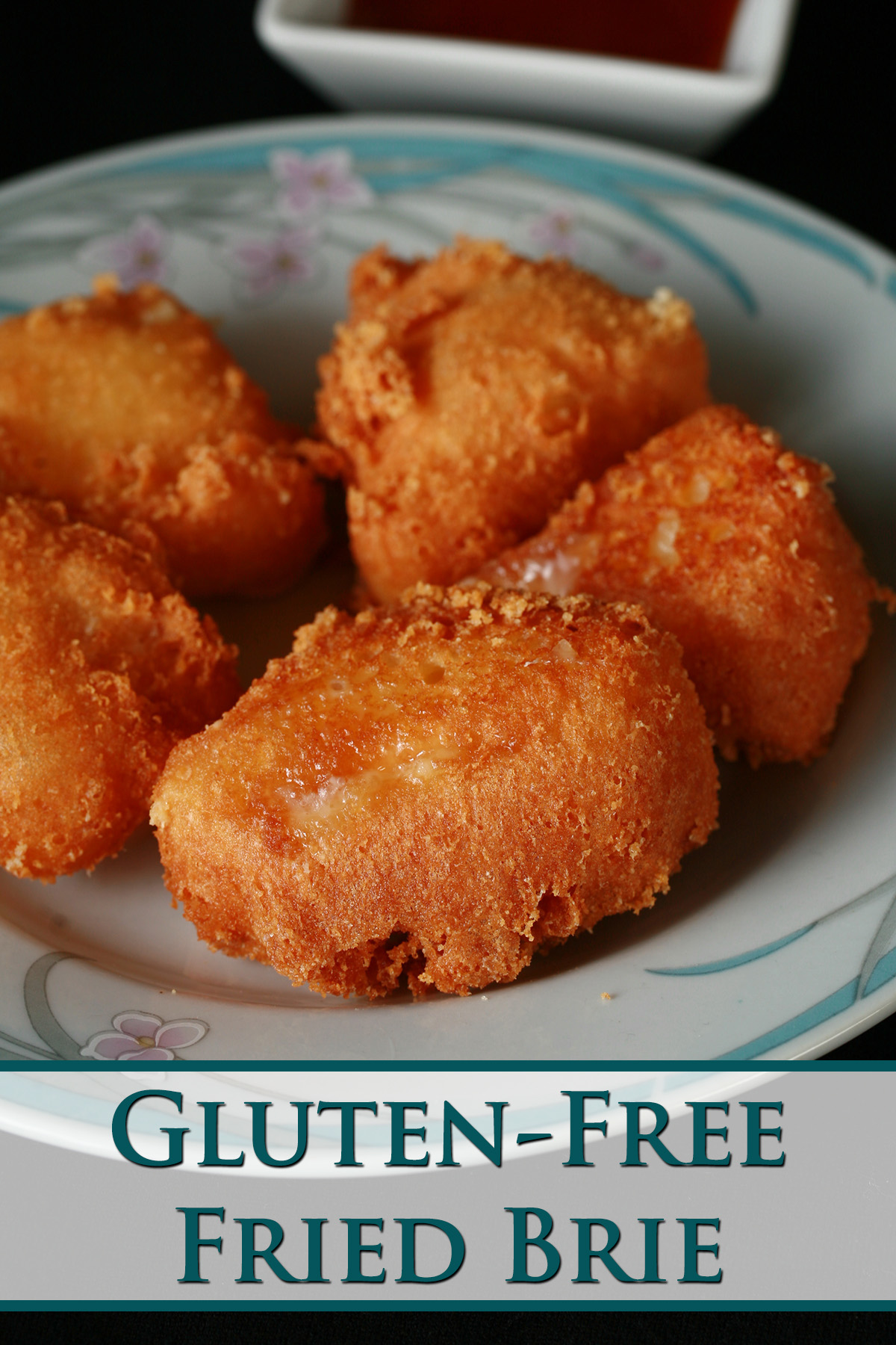 Several small wedges of gluten-free deep fried brie. There is a small bowl of apricot preserves next to the plate.