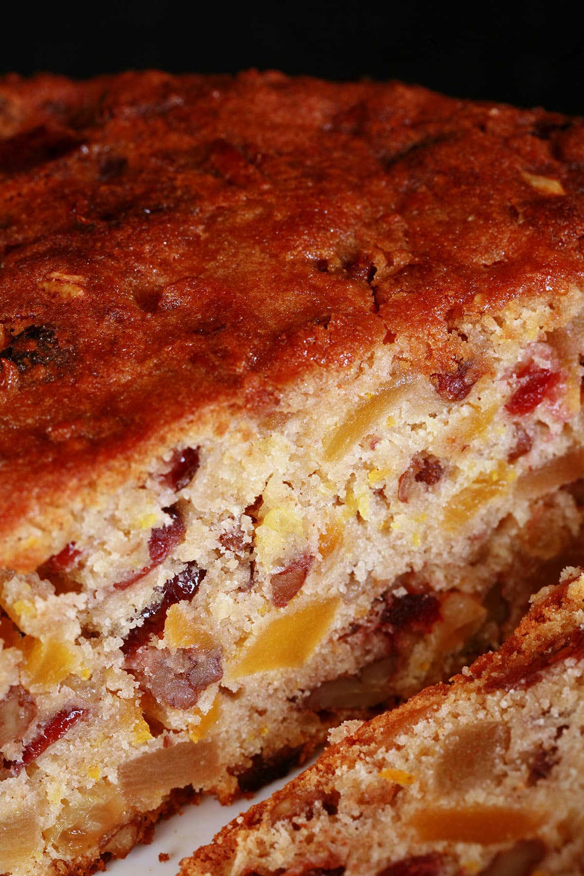 A sliced up gluten free fruitcake.