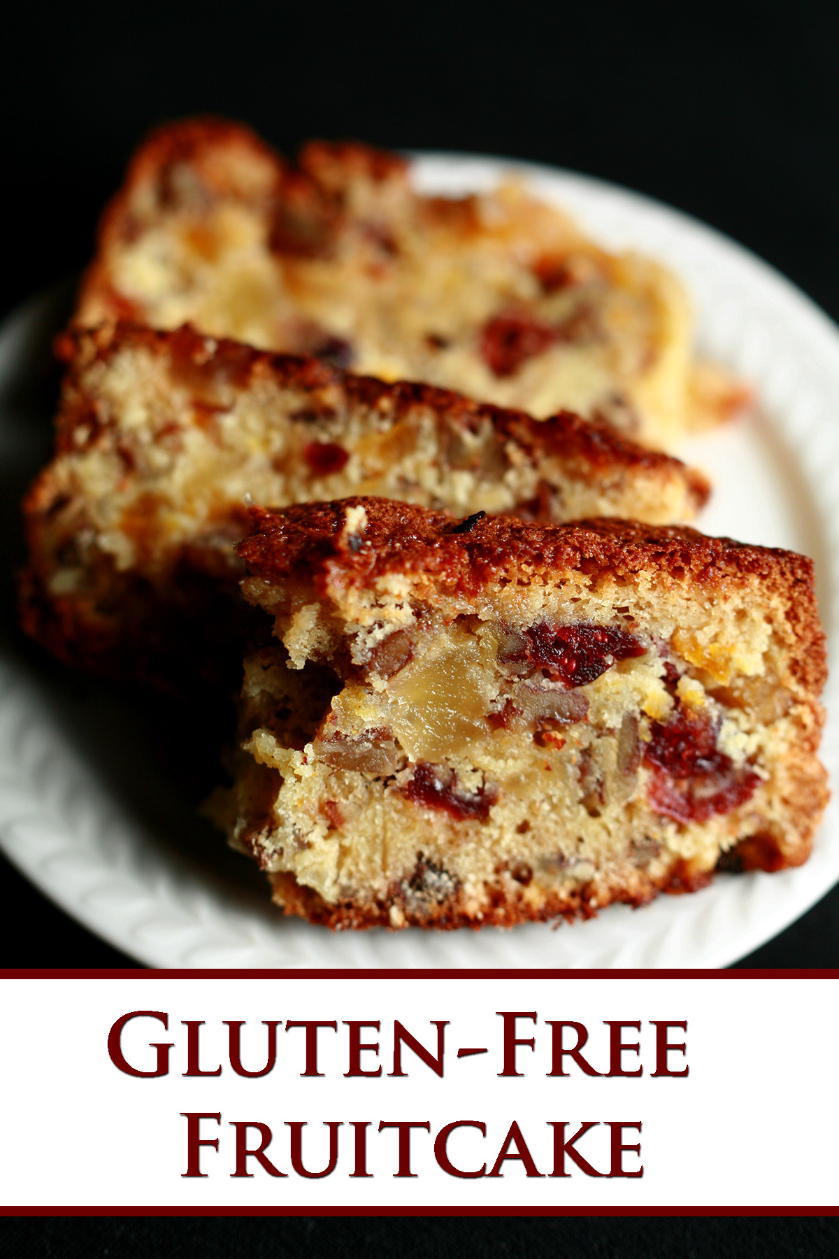 Slices of fruitcake, on a small white plate. The cake is generously studded with dried - not candied - fruit.