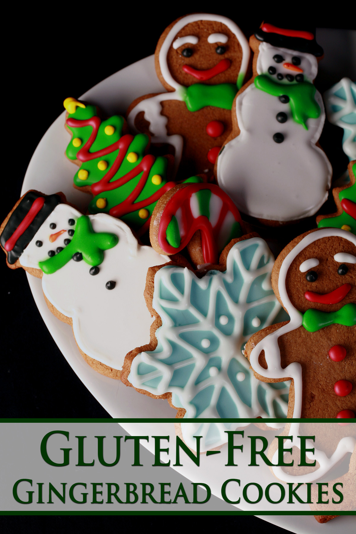 A plate of gluten-free gingerbread cookies, in various shapes, decorated with colourful royal icing.