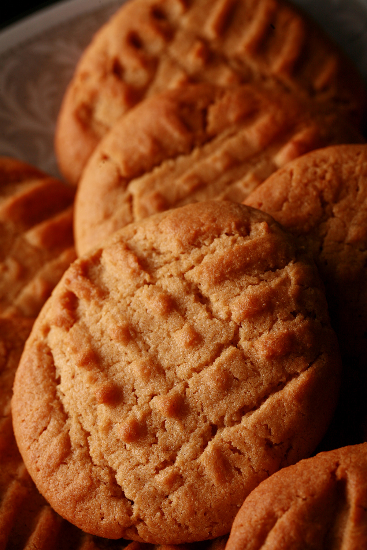 A plate of soft and chewy gluten free peanut butter cookies.