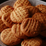 A plate of soft and chewy gluten free peanut butter cookies.