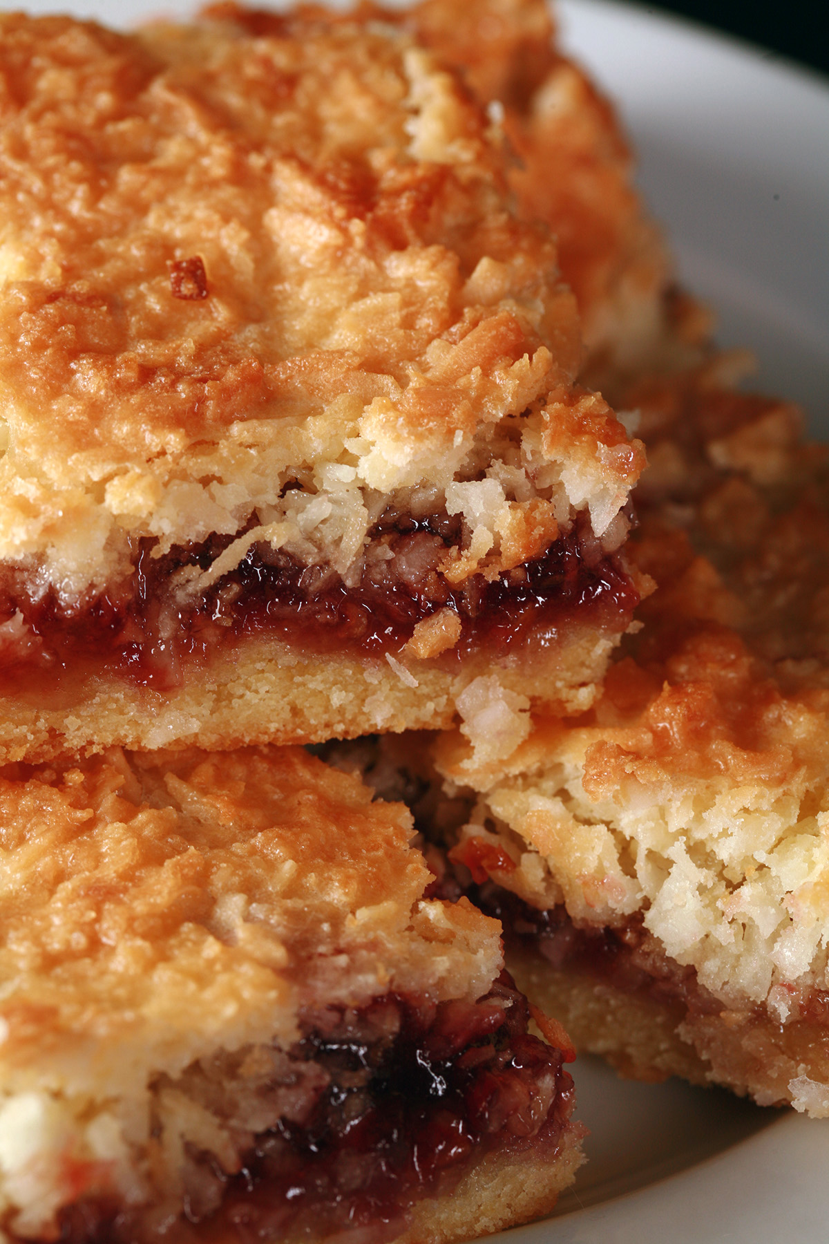 A plate of gluten-free raspberry squaress.