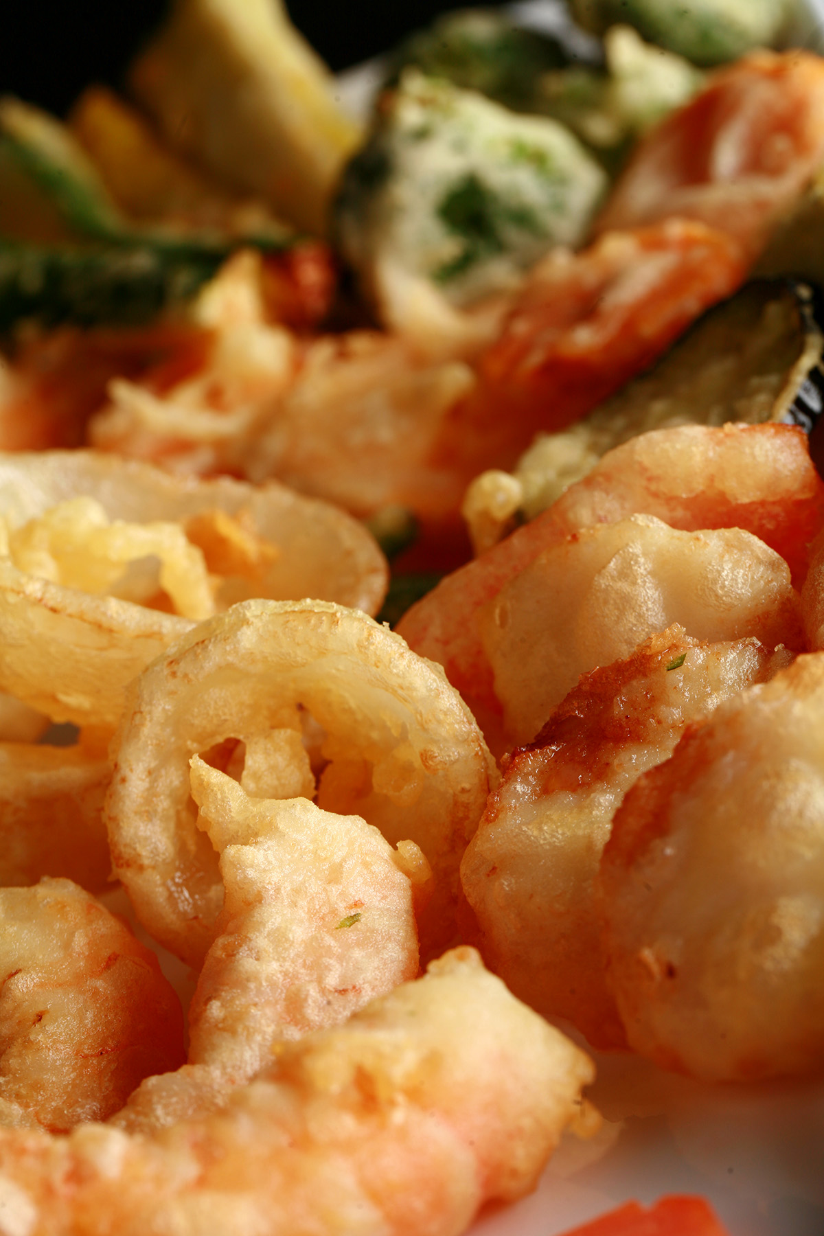 A tray of gluten free tempura shrimp and vegetables.