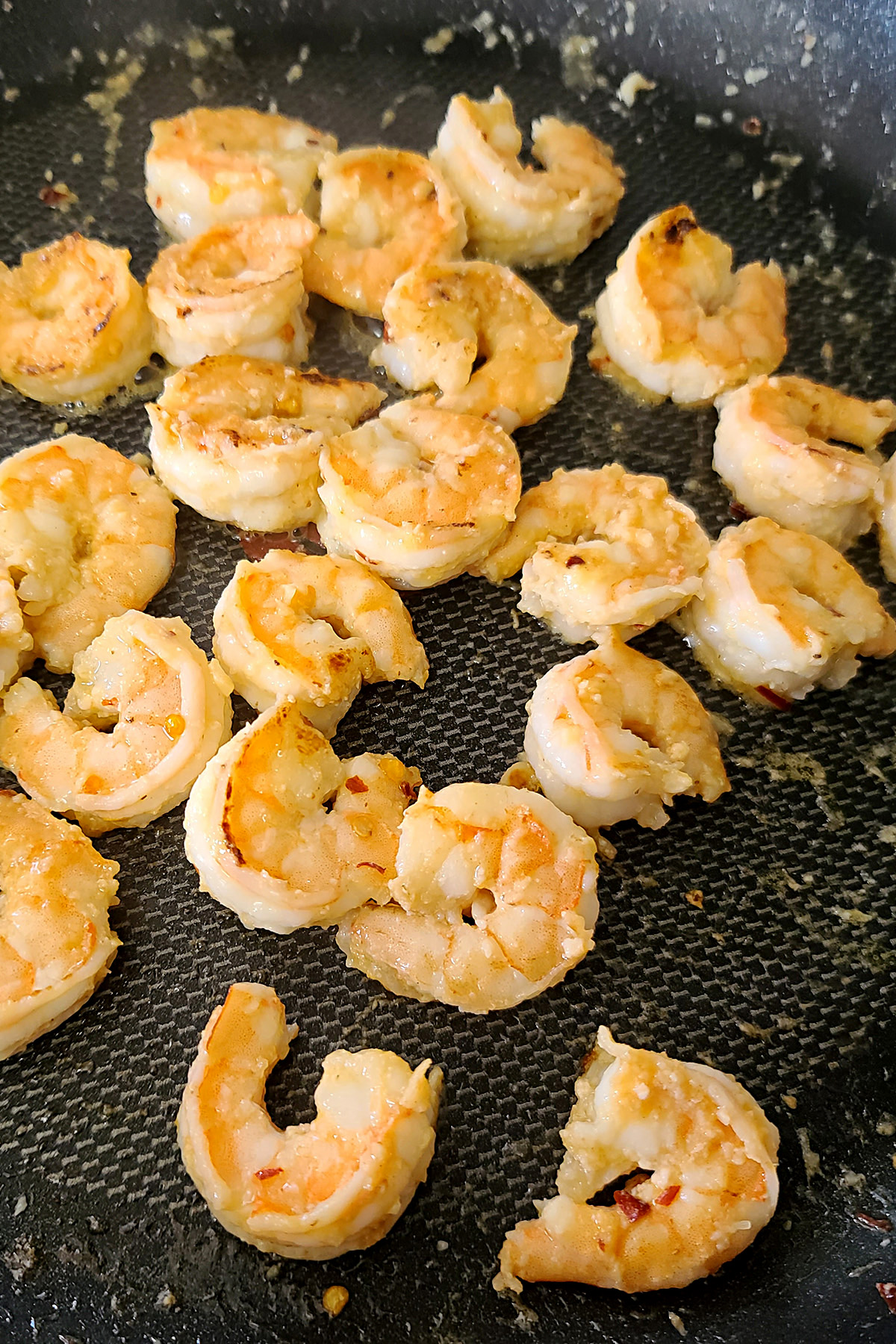 Shrimp cooking in a pan.