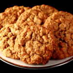 Close up photo of a plate of gluten-free oatmeal cookies with visible butterscotch chips