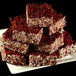 Gluten-Free Puffed Rice Bars, on a white square plate.