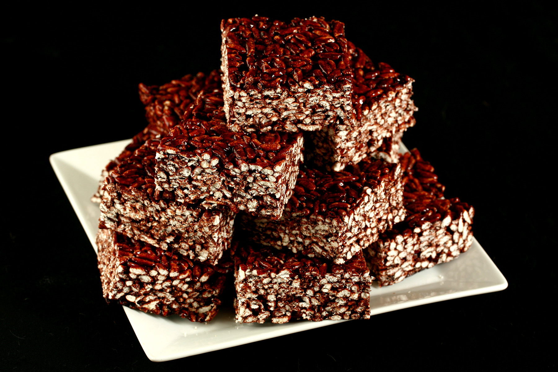 Gluten-Free Puffed Rice Bars, on a white square plate.