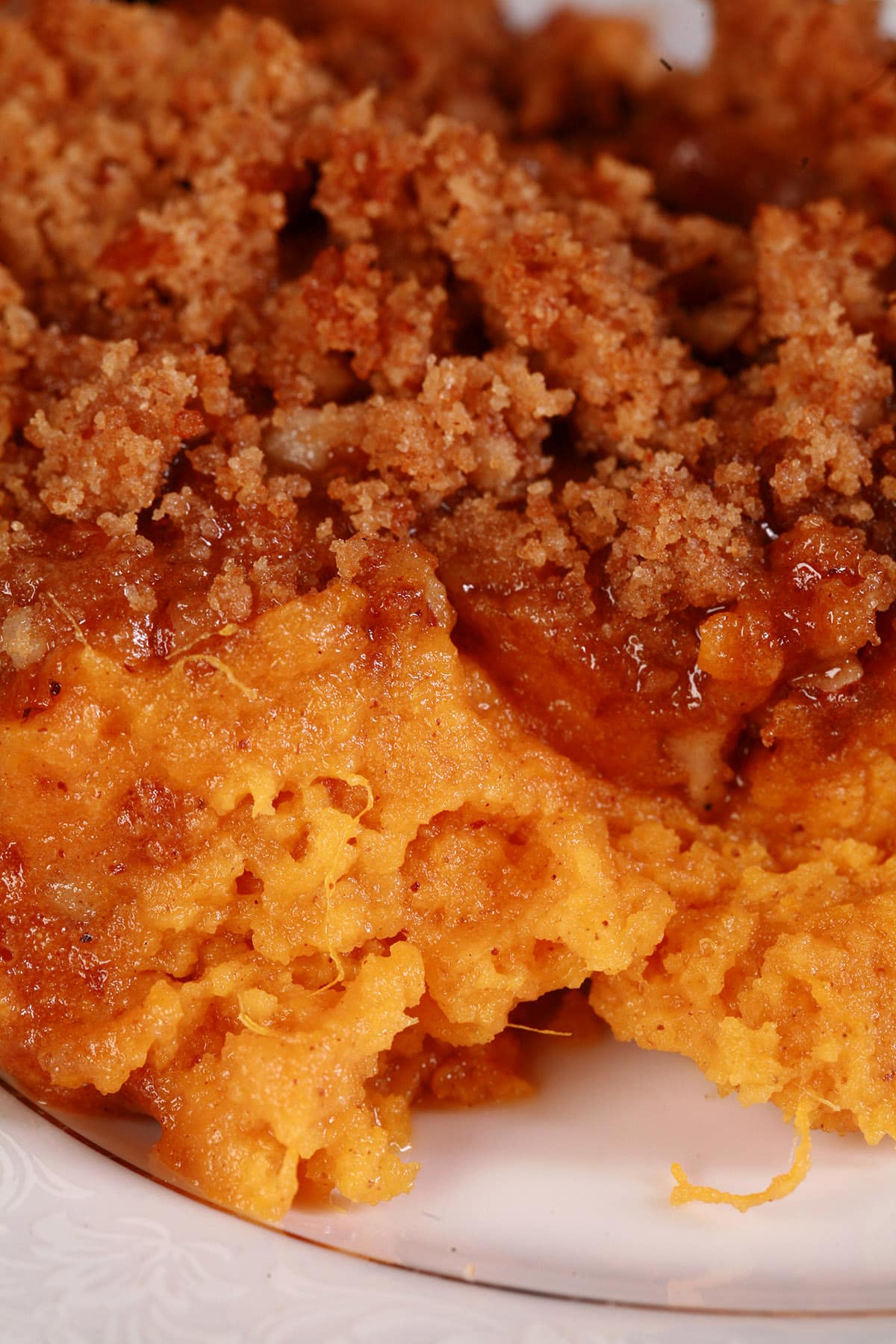 A close up view of a pan of sweet potato souffle.